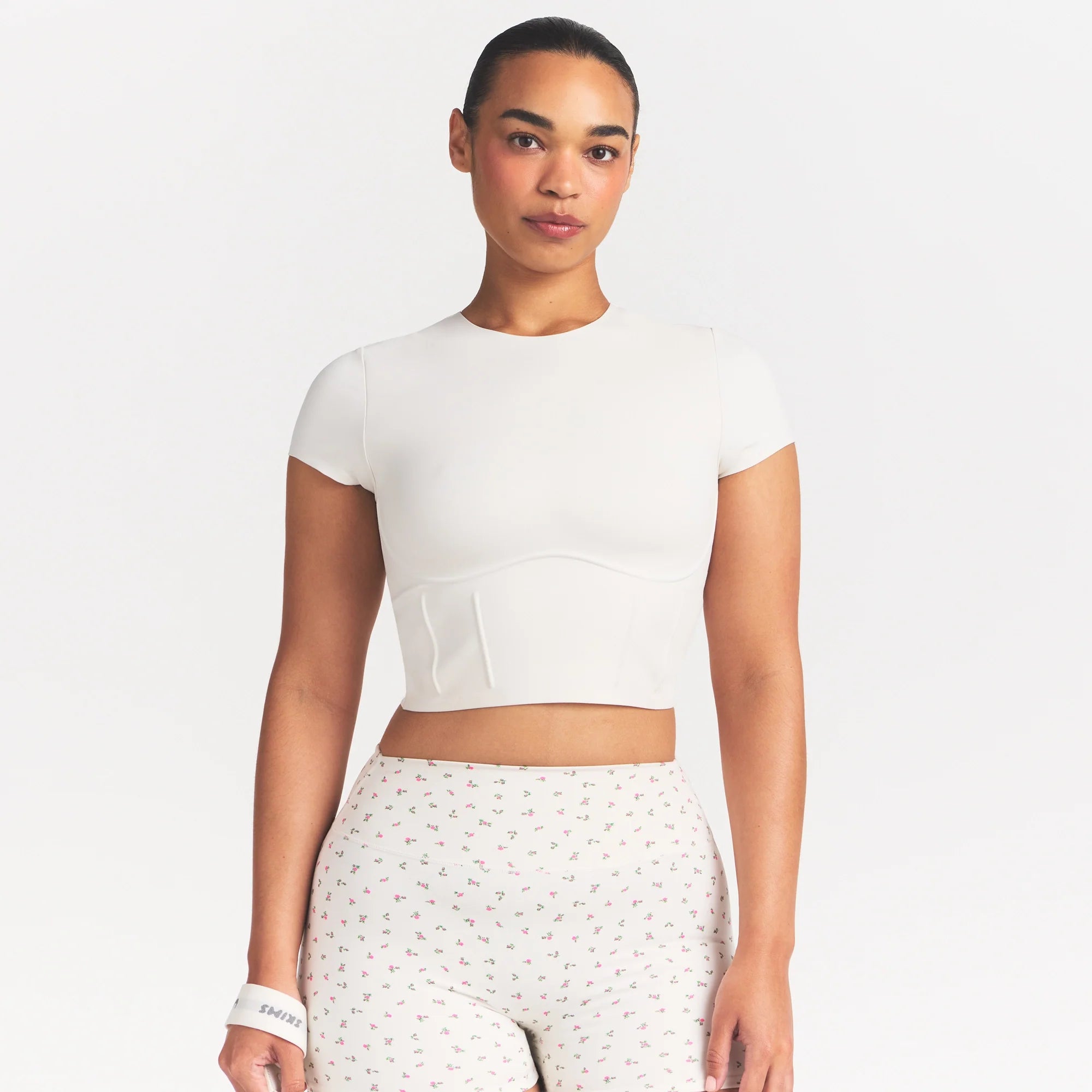 NikeSKIMS MATTE CORSET CROP TOP | IVORY ON A MODEL 