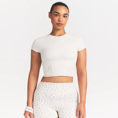 NikeSKIMS MATTE CORSET CROP TOP | IVORY ON A MODEL 