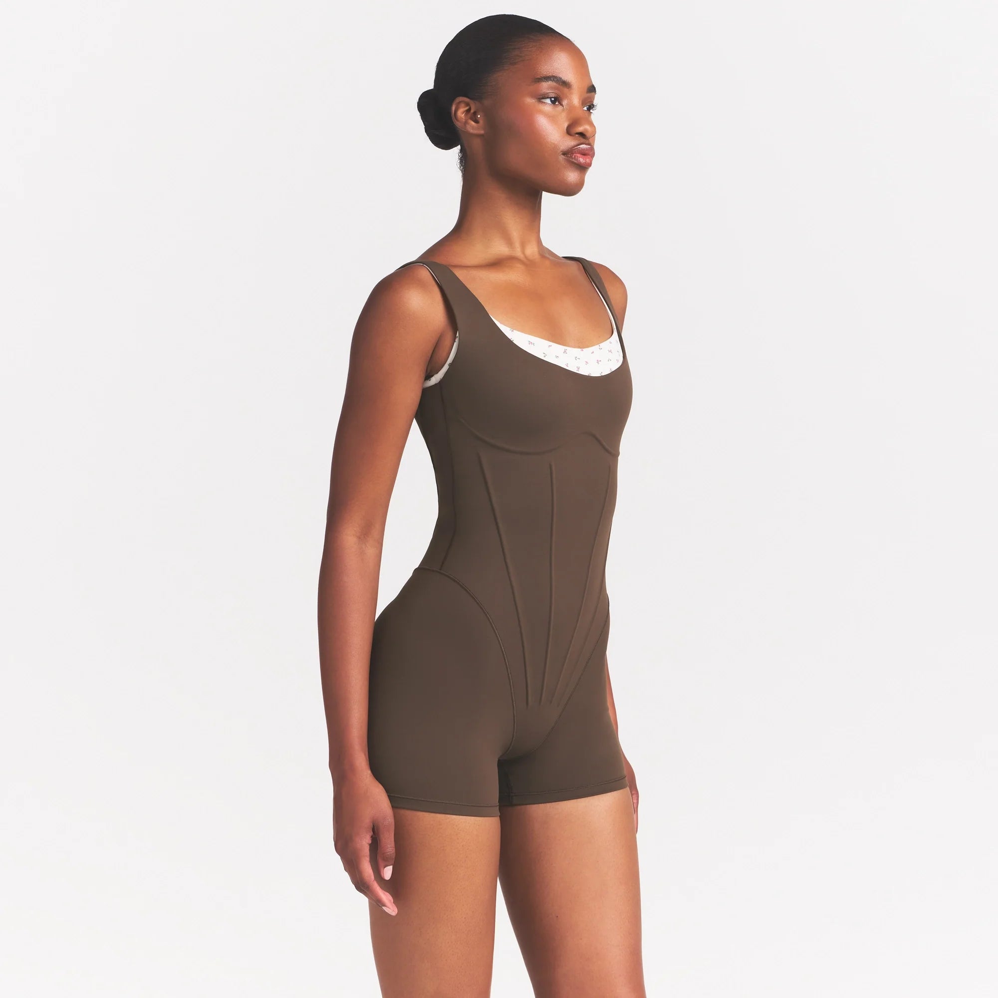 NikeSKIMS MATTE CORSET 2" ONE PIECE | DARK SEPIA ON A MODEL 