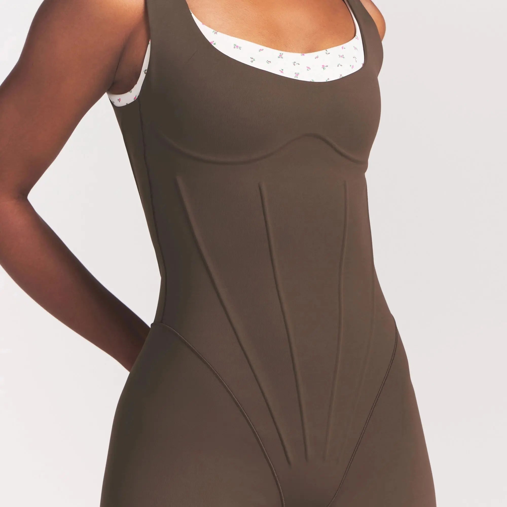 NikeSKIMS MATTE CORSET 2" ONE PIECE | DARK SEPIA ON A MODEL 