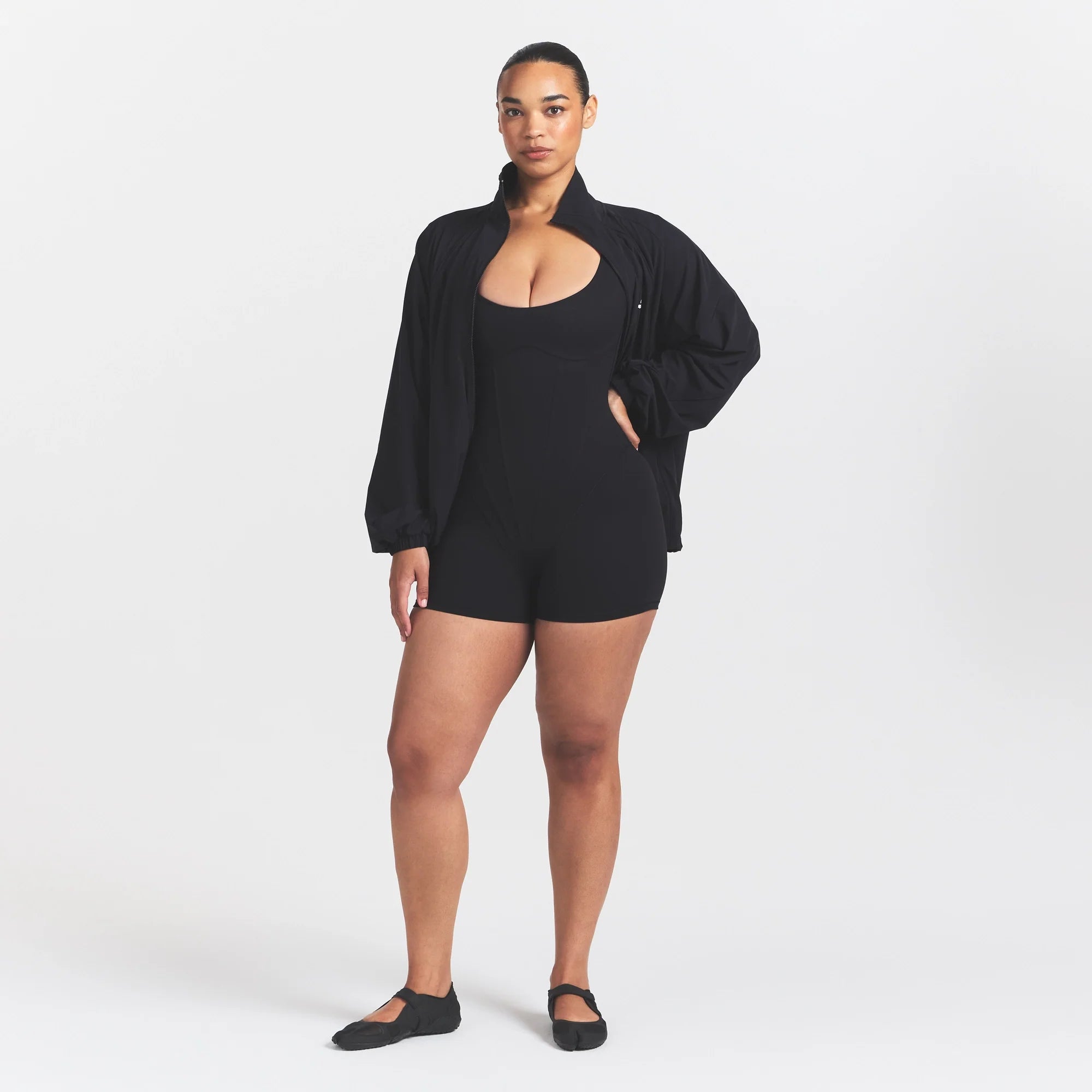 NikeSKIMS MATTE CORSET 2" ONE PIECE | OBSIDIAN ON A MODEL 