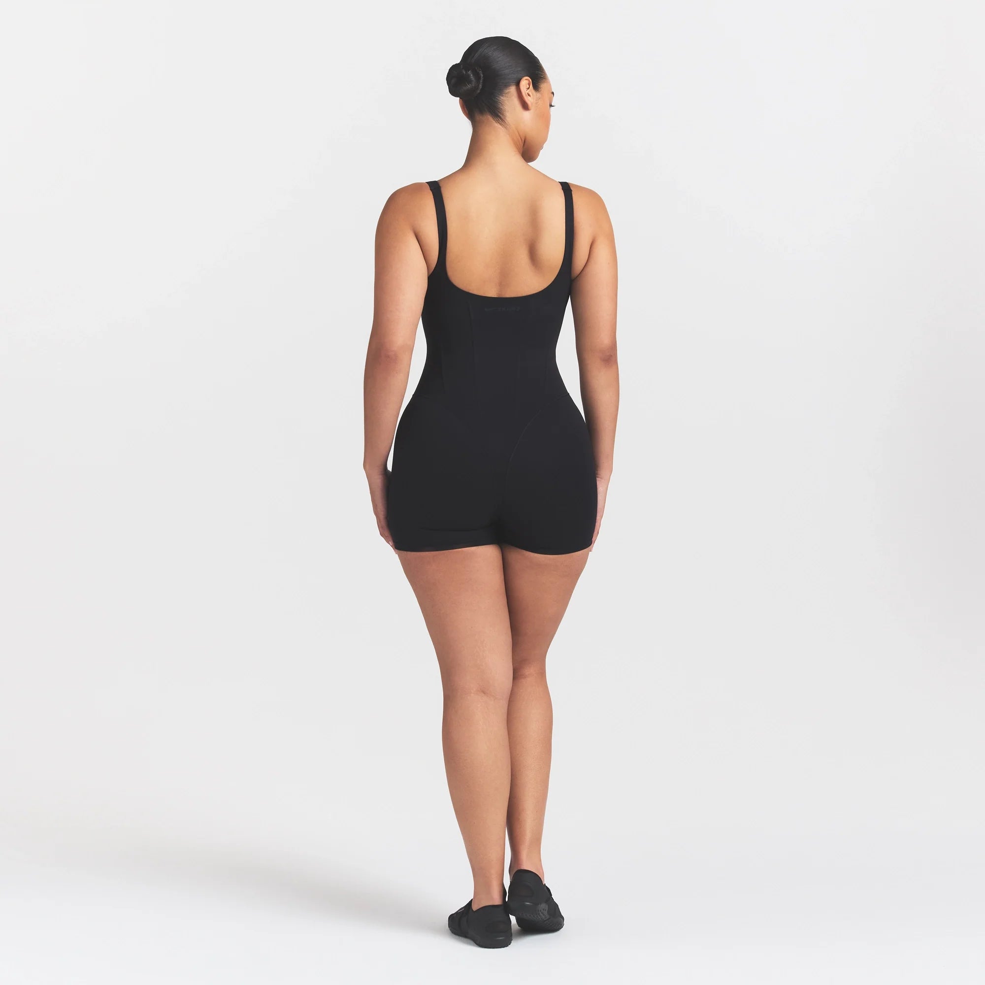 NikeSKIMS MATTE CORSET 2" ONE PIECE | OBSIDIAN ON A MODEL 