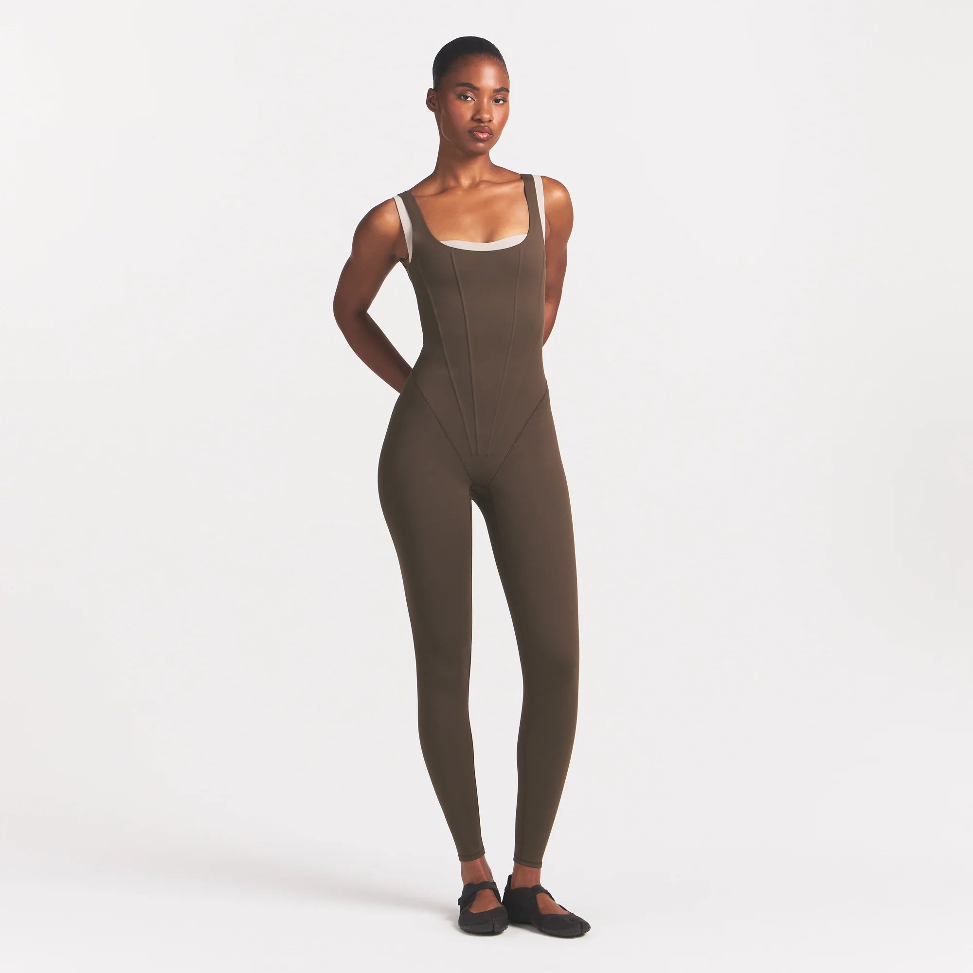 NikeSKIMS MATTE CORSET 29" ONE PIECE | DARK SEPIA ON A MODEL 