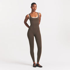 NikeSKIMS MATTE CORSET 29" ONE PIECE | DARK SEPIA ON A MODEL 