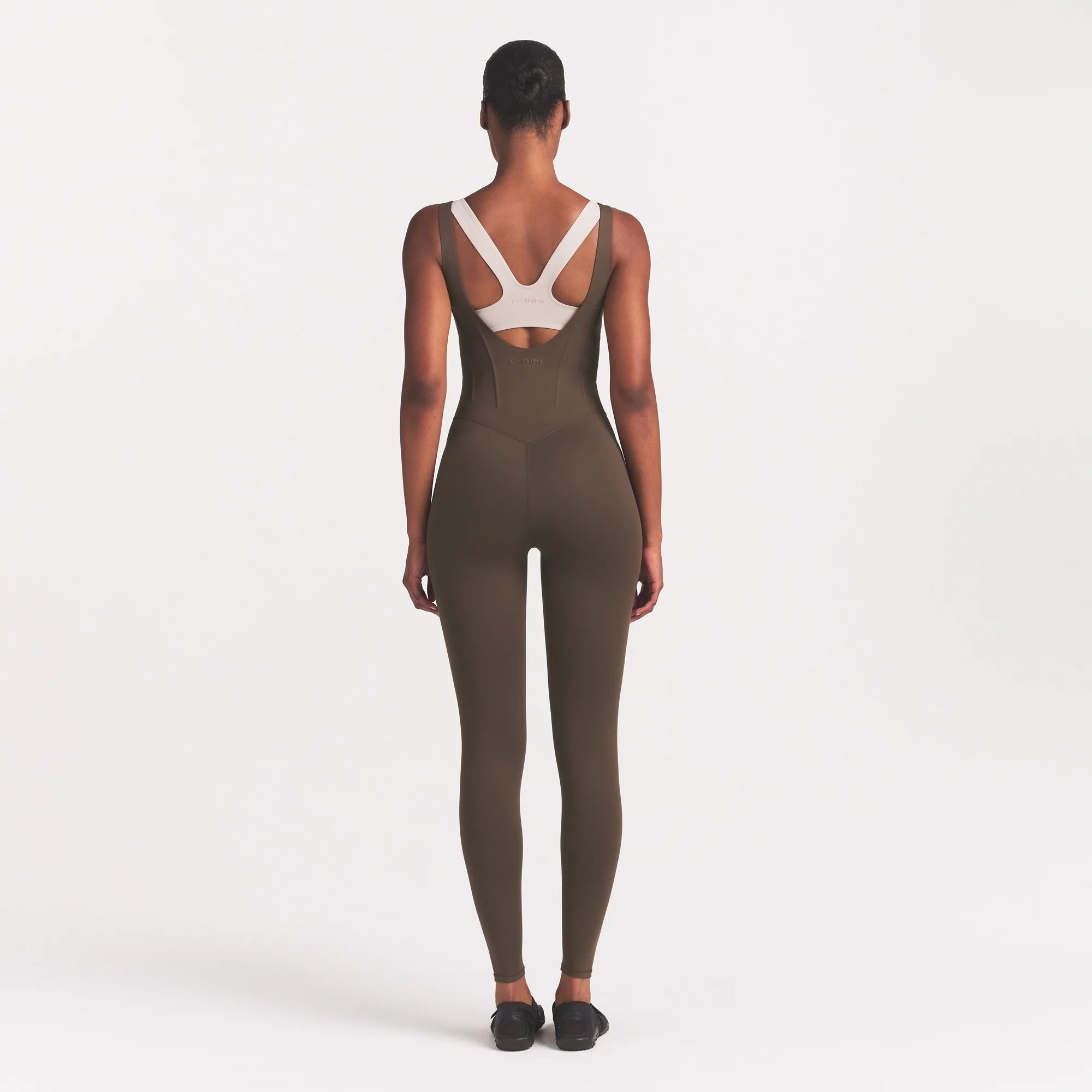 NikeSKIMS MATTE CORSET 29" ONE PIECE | DARK SEPIA ON A MODEL 