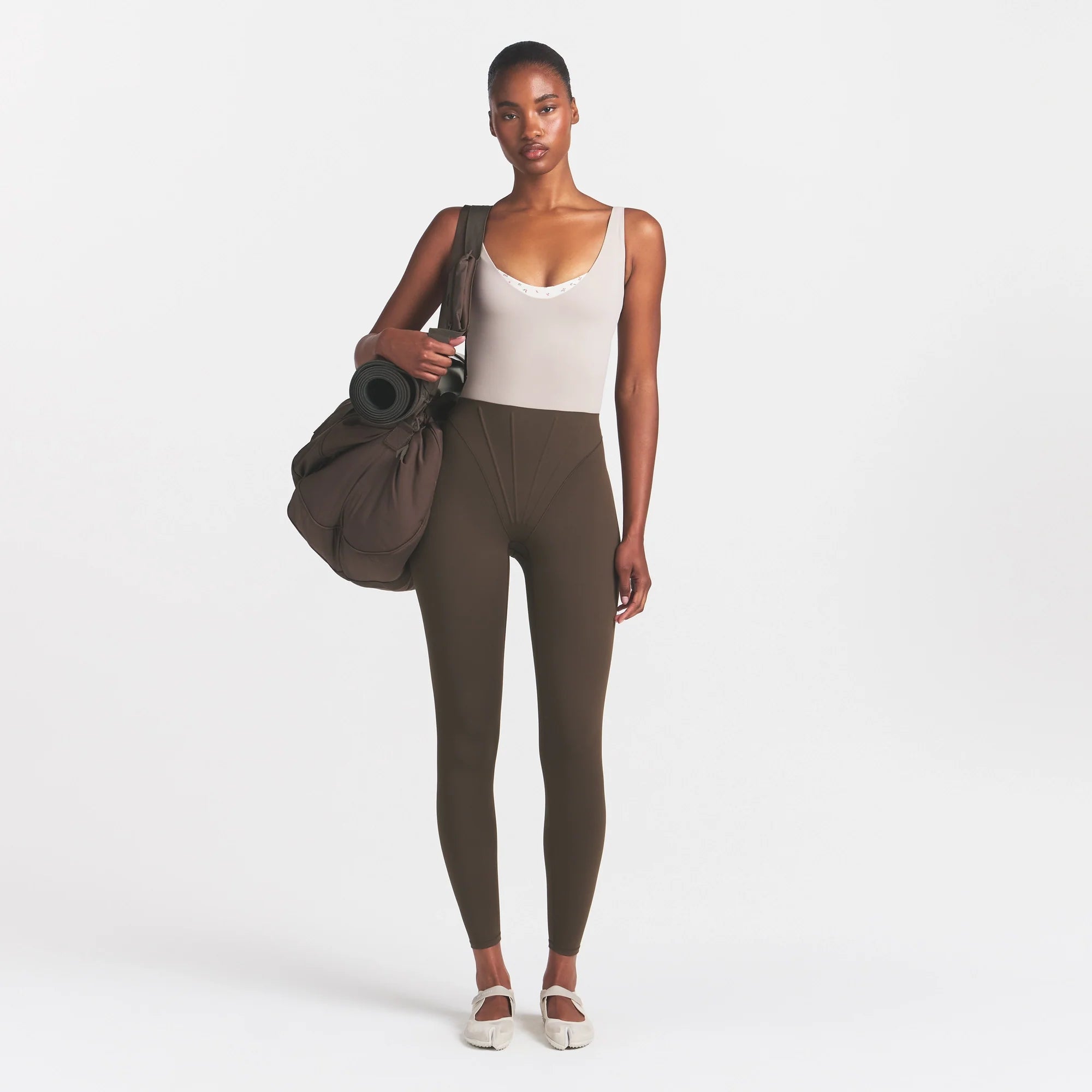 NikeSKIMS MATTE HIGH WAIST CORSET 26" LEGGING | DARK SEPIA ON A MODEL 