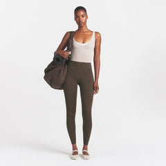 NikeSKIMS MATTE HIGH WAIST CORSET 26" LEGGING | DARK SEPIA ON A MODEL 