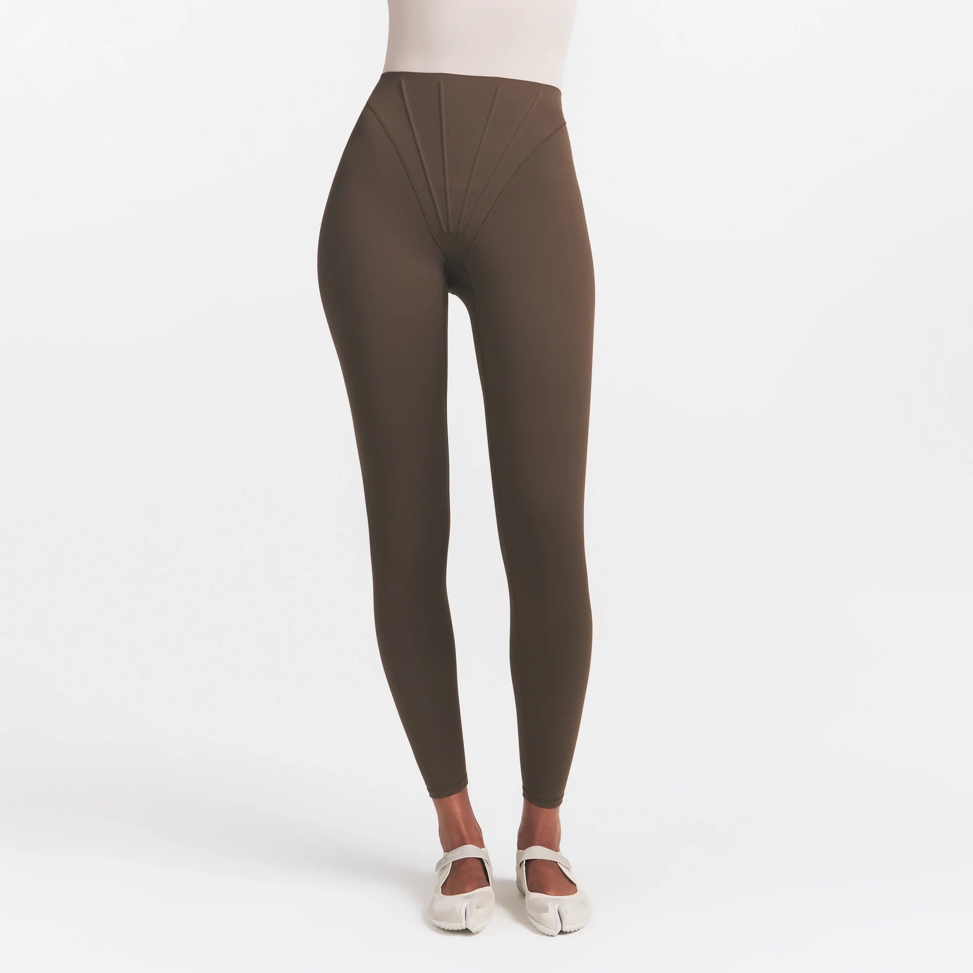 NikeSKIMS MATTE HIGH WAIST CORSET 26" LEGGING | DARK SEPIA ON A MODEL 