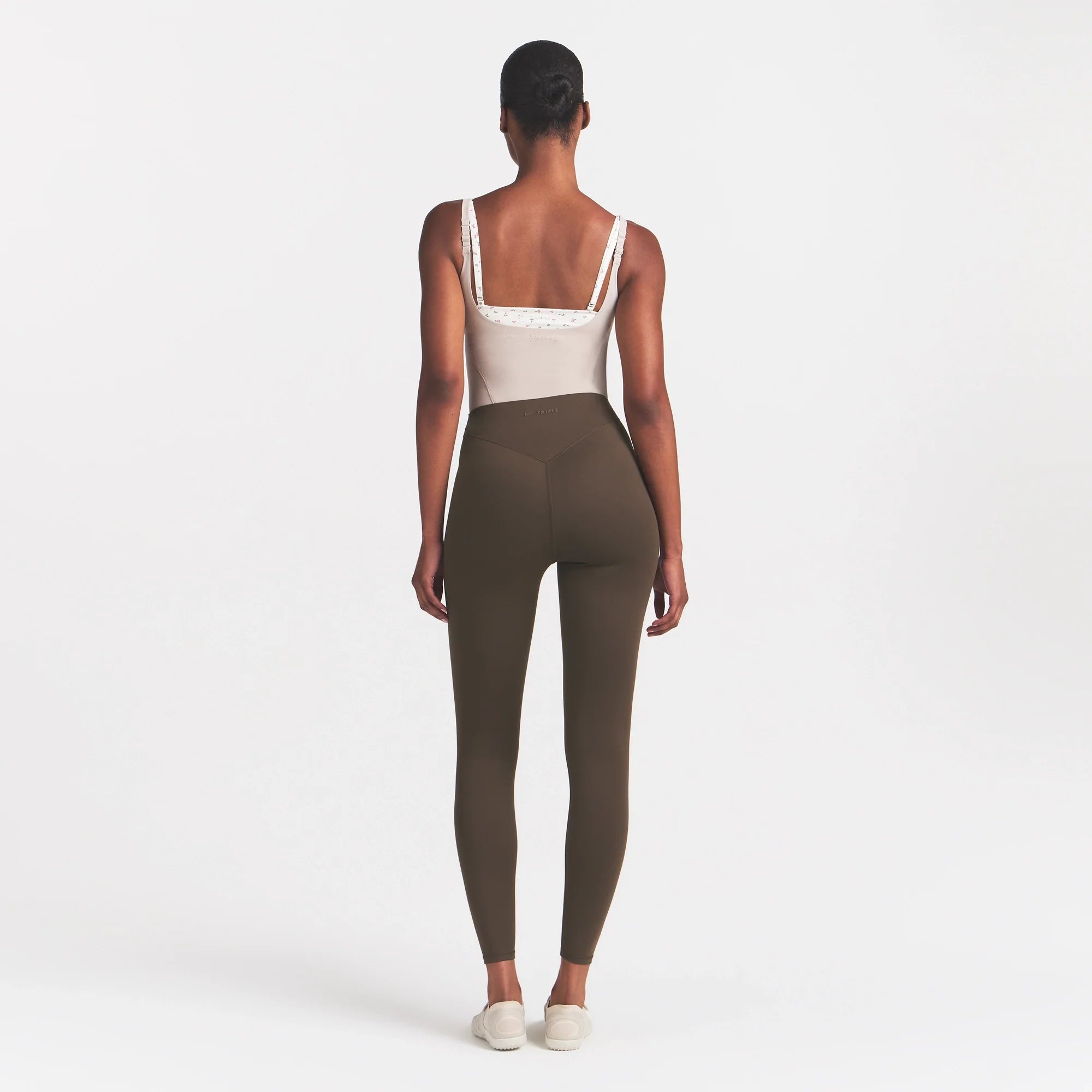 NikeSKIMS MATTE HIGH WAIST CORSET 26" LEGGING | DARK SEPIA ON A MODEL 