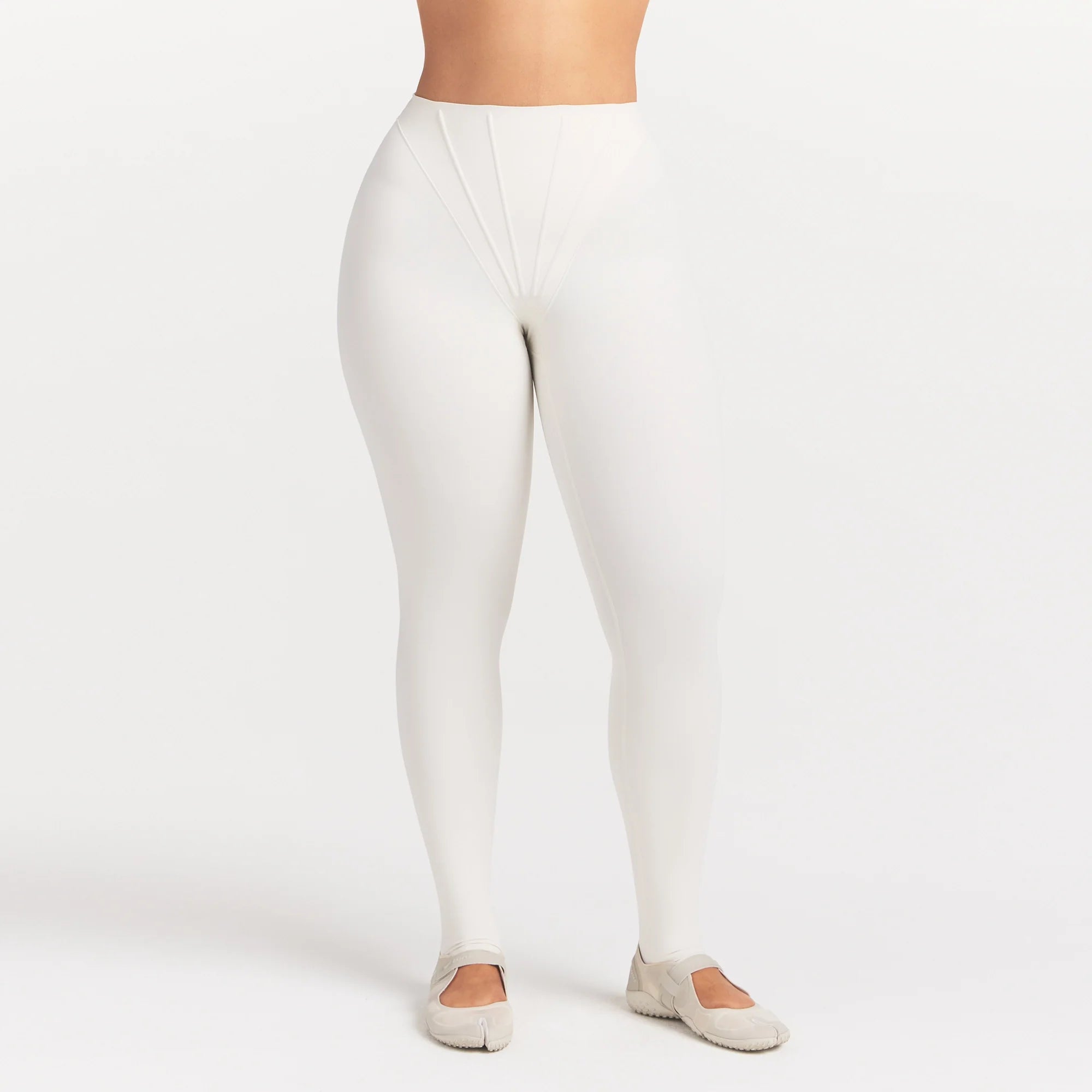 NikeSKIMS MATTE HIGH WAIST CORSET 26" LEGGING | IVORY ON A MODEL 