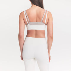 NikeSKIMS MATTE CROP 17" LEGGING | IVORY ON A MODEL 
