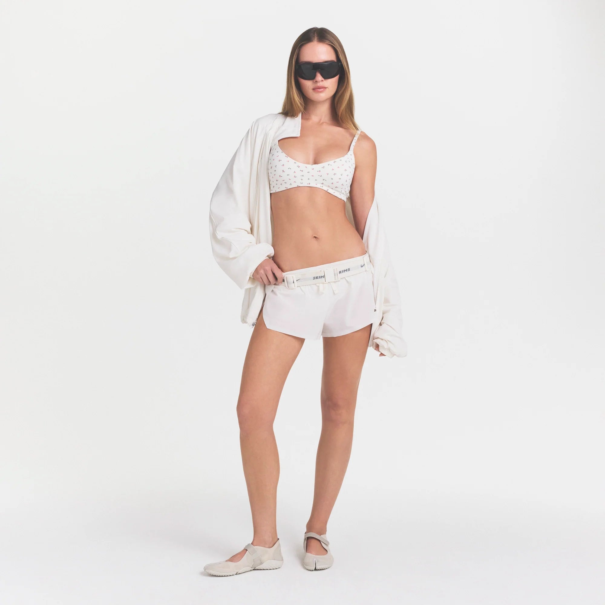 NikeSKIMS STRETCH NYLON OVERSIZED JACKET | IVORY ON A MODEL VIEW