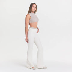 NikeSKIMS MATTE SLIM FLARE LEGGING | IVORY ON A MODEL 