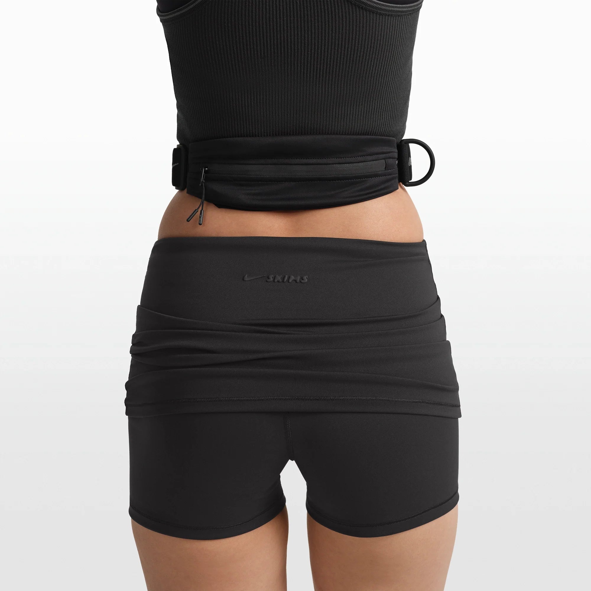 NikeSKIMS ACCESSORIES WAISTPACK | OBSIDIAN ON A MODEL FRONT VIEW @ | FOCUS: 0.0, 1.0, 0.9