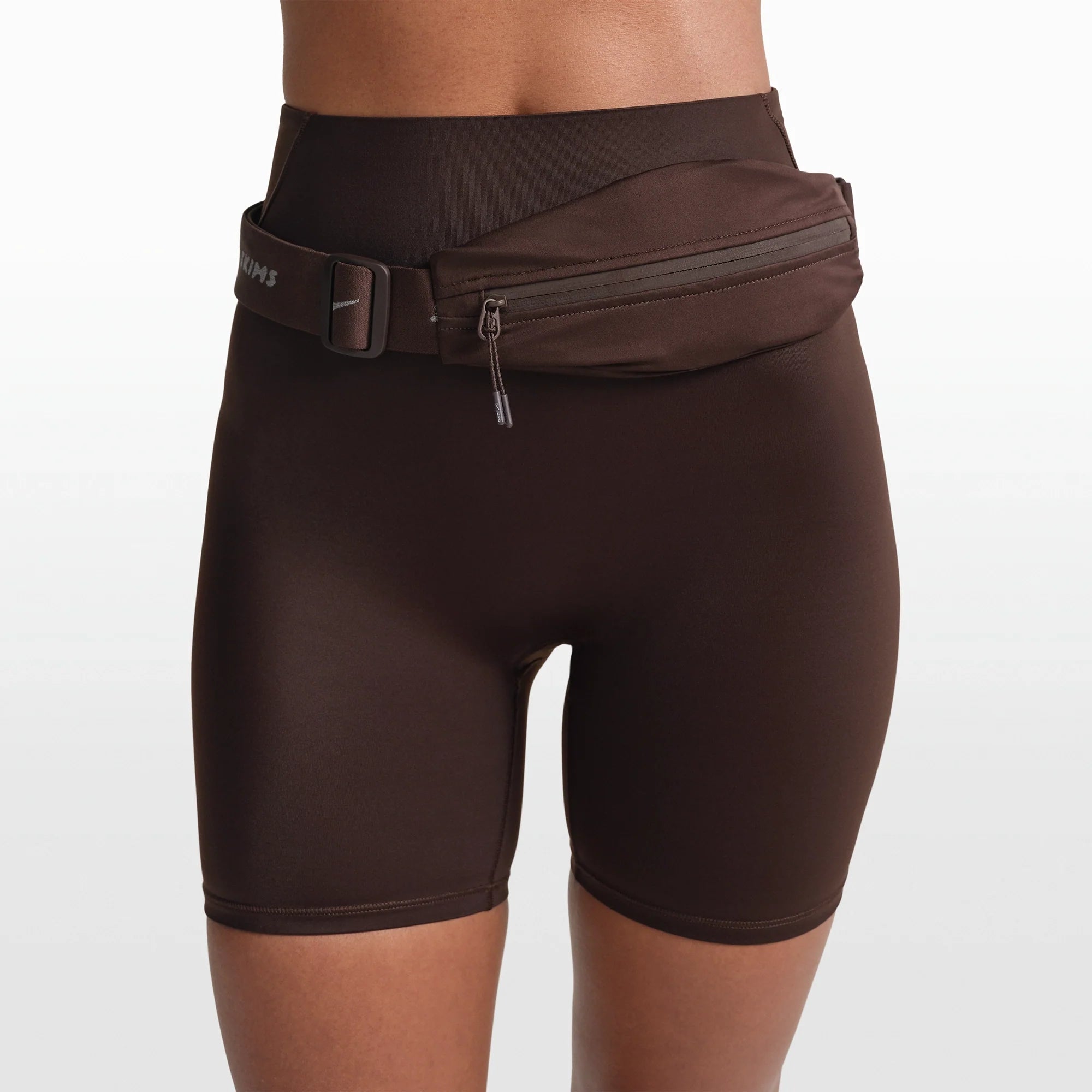 NikeSKIMS ACCESSORIES WAISTPACK | PHOENIX ON A MODEL FRONT VIEW @ | FOCUS: 0.0, 1.0, 0.9