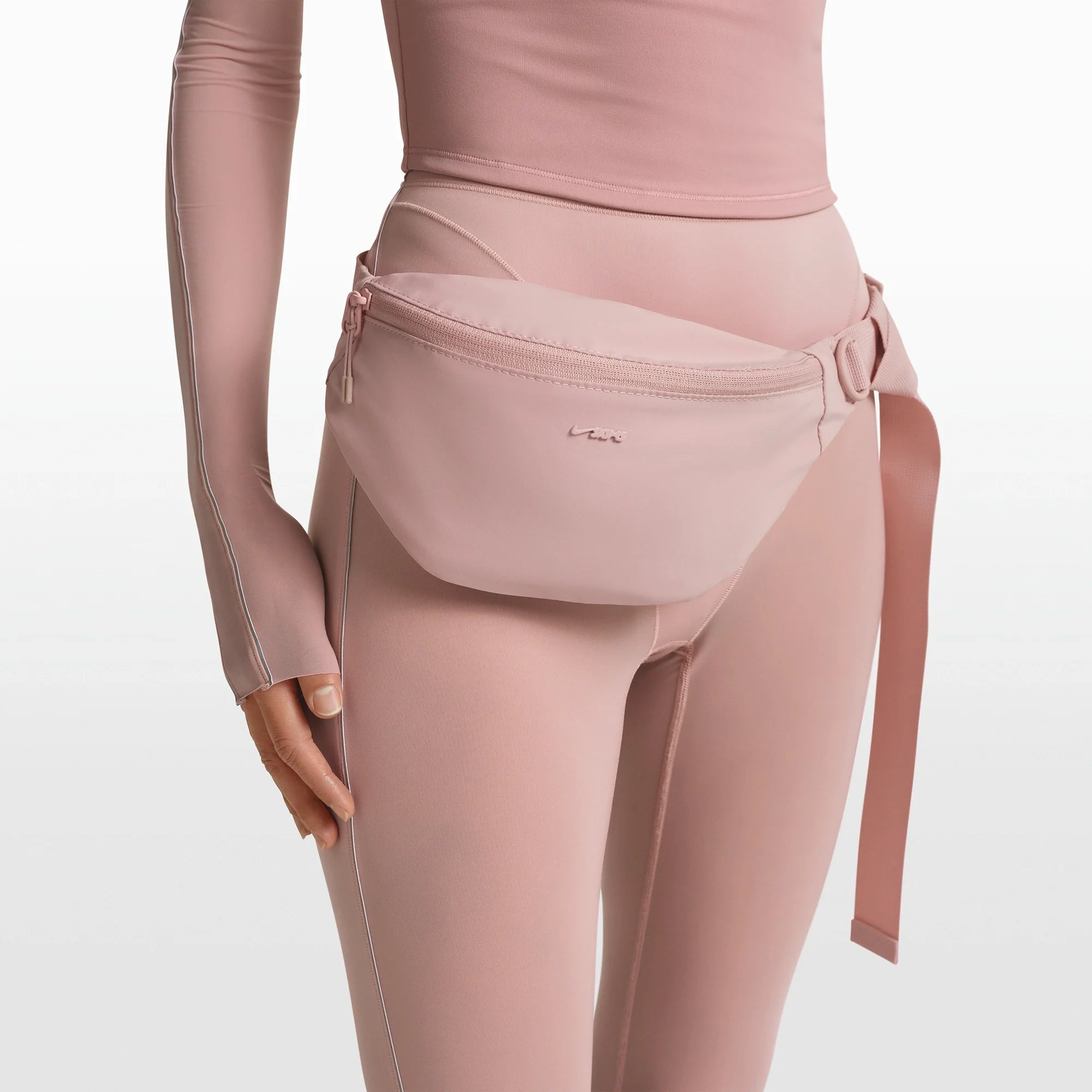 NikeSKIMS ACCESSORIES FANNY PACK | HIMALAYAN ON A MODEL FRONT VIEW @ | FOCUS: 0.0, 1.0, 0.9