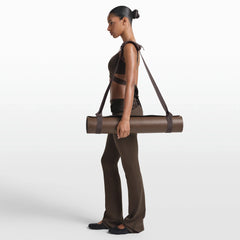 NikeSKIMS ACCESSORIES YOGA MAT STRAP | DARK SEPIA ON A MODEL FRONT VIEW @ | FOCUS: 0.0, 1.0, 0.9
