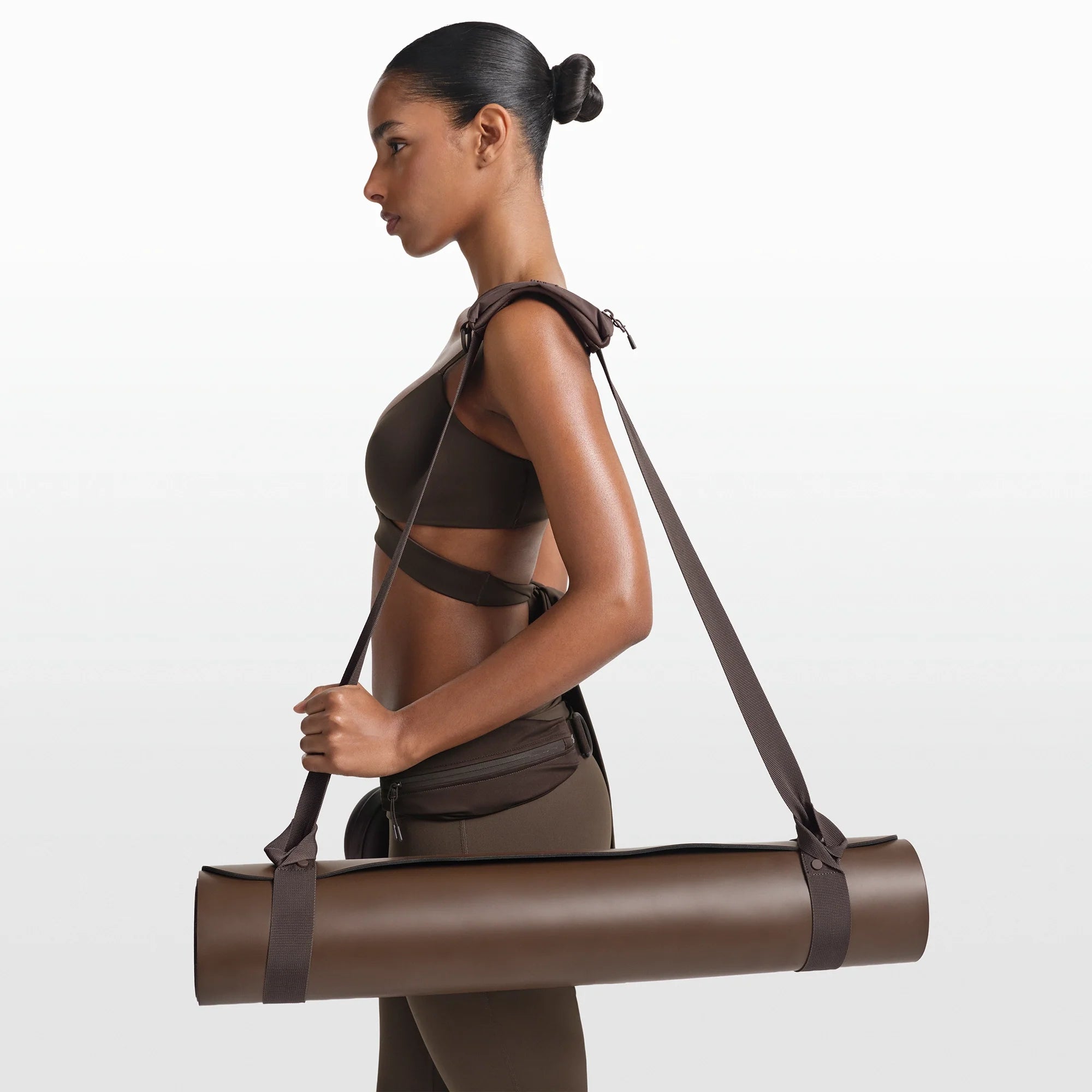 NikeSKIMS ACCESSORIES YOGA MAT STRAP | DARK SEPIA ON A MODEL FRONT VIEW @ | FOCUS: 0.0, 1.0, 0.9