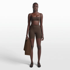 NikeSKIMS ACCESSORIES SMALL TOWEL | DARK SEPIA ON A MODEL FRONT VIEW @ | FOCUS: 0.0, 1.0, 0.9