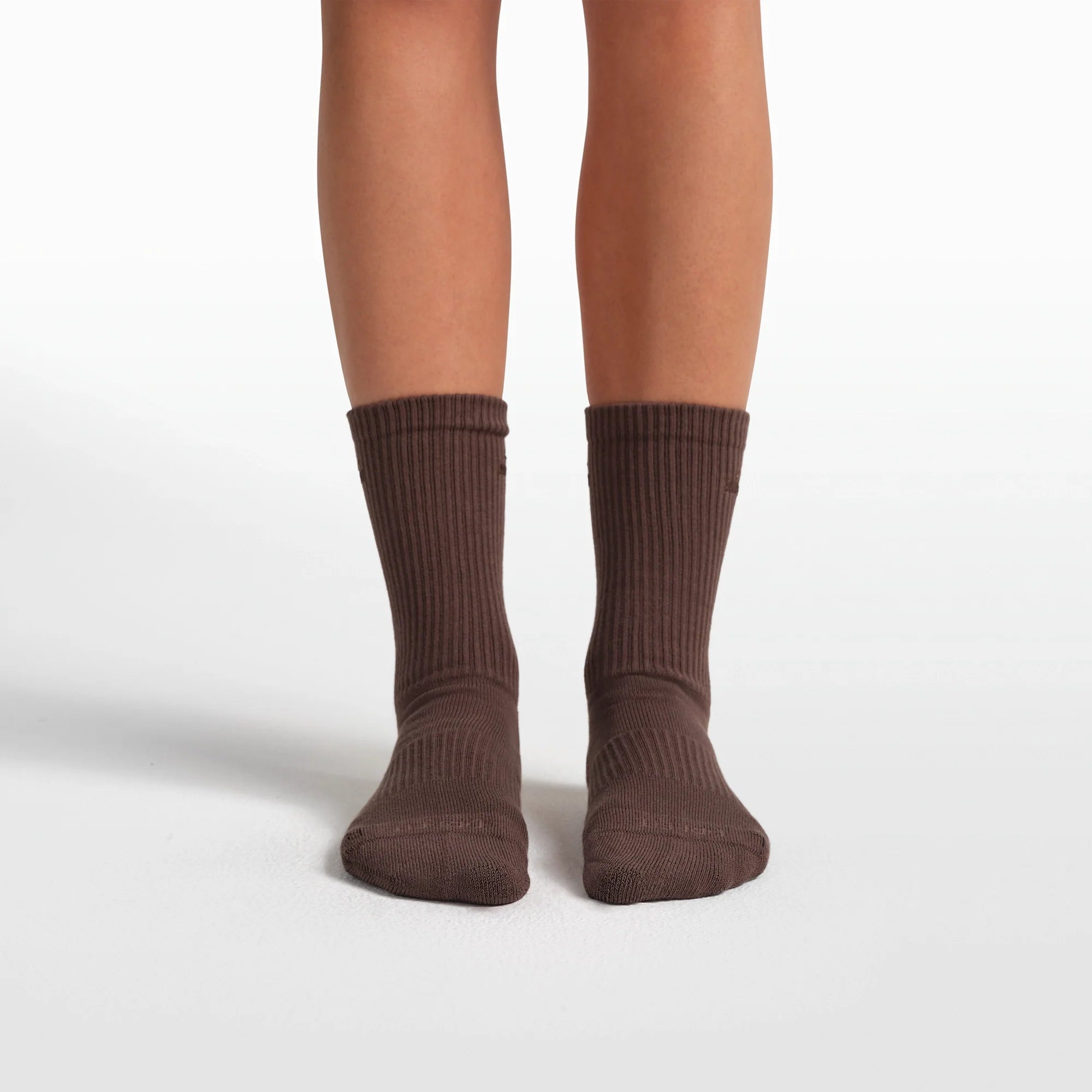 NikeSKIMS ACCESSORIES DRI-FIT PILATES GRIP CREW SOCK | DARK SEPIA FLAT ON A WHITE BACKGROUND