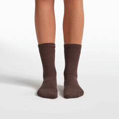 NikeSKIMS ACCESSORIES DRI-FIT PILATES GRIP CREW SOCK | DARK SEPIA FLAT ON A WHITE BACKGROUND