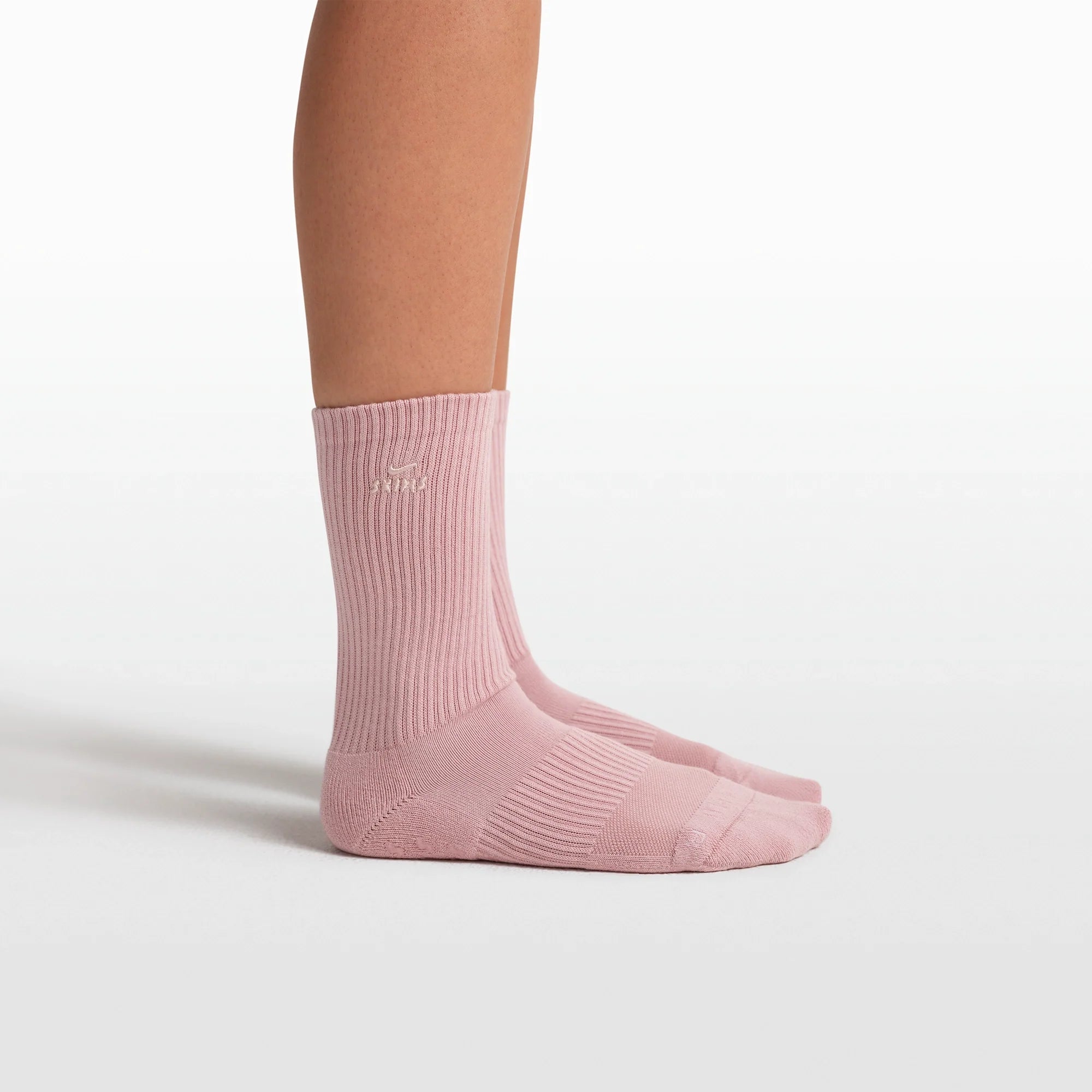 NikeSKIMS ACCESSORIES DRI-FIT PILATES GRIP CREW SOCK | HIMALAYAN FLAT ON A WHITE BACKGROUND