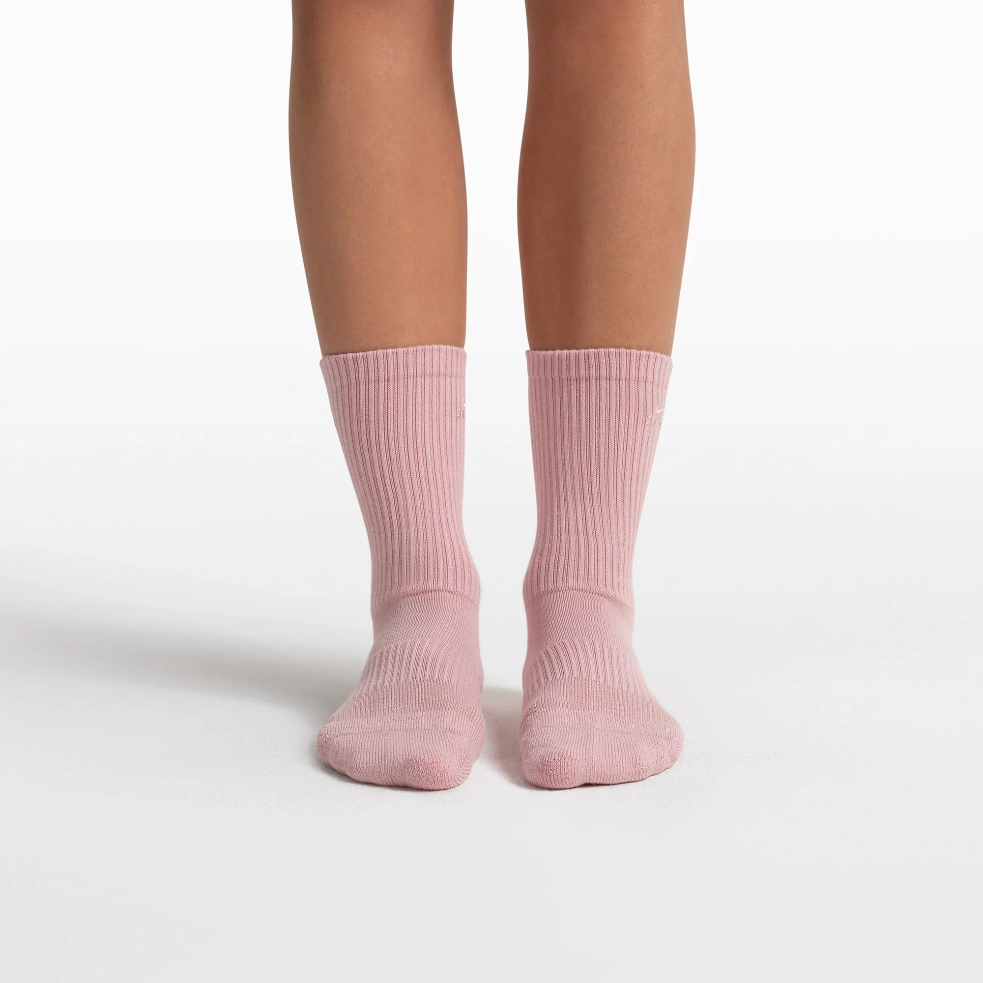 NikeSKIMS ACCESSORIES DRI-FIT PILATES GRIP CREW SOCK | HIMALAYAN FLAT ON A WHITE BACKGROUND
