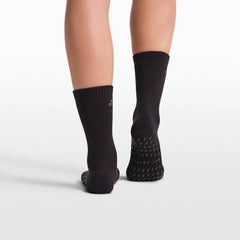 NikeSKIMS ACCESSORIES DRI-FIT PILATES GRIP CREW SOCK | OBSIDIAN FLAT ON A WHITE BACKGROUND