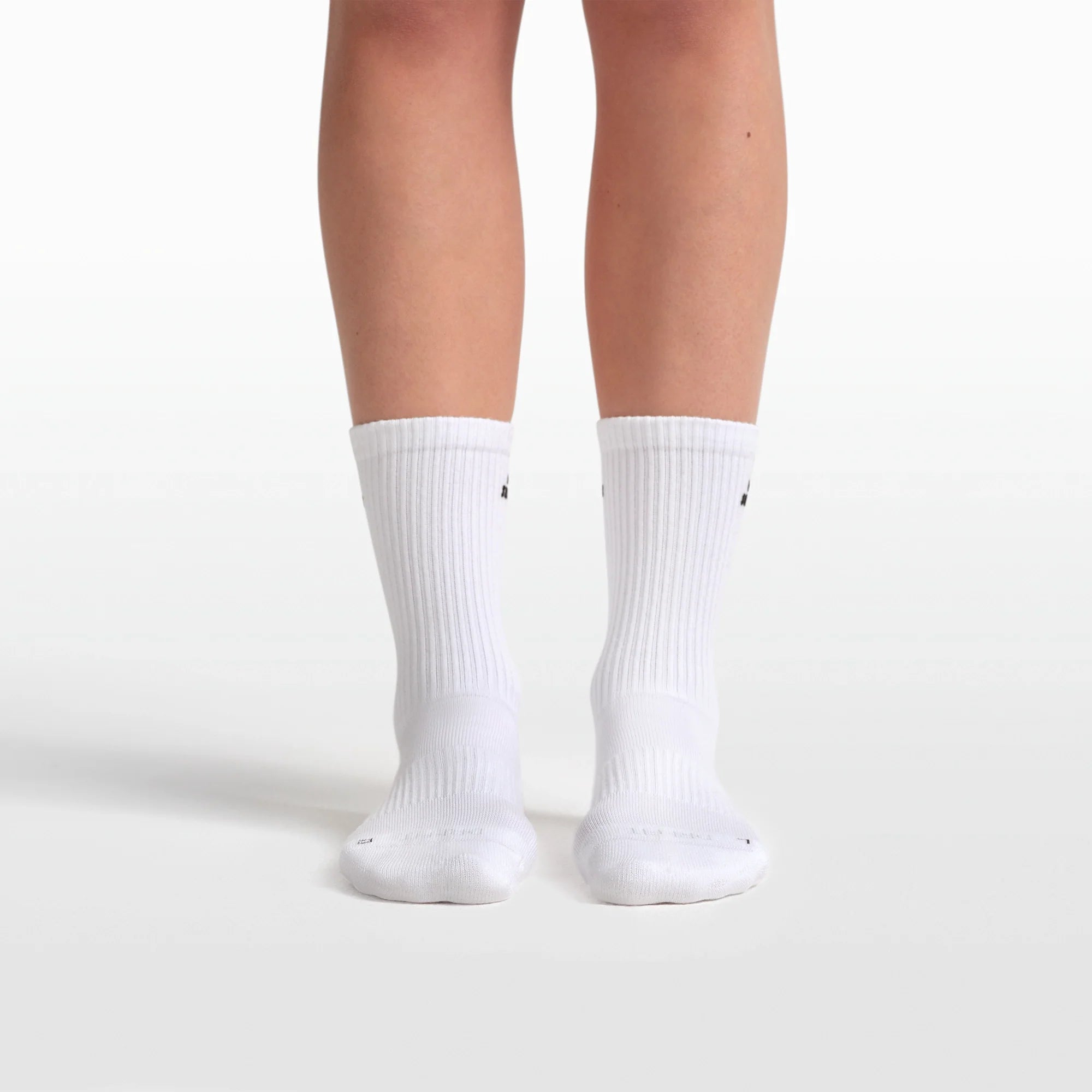 NikeSKIMS ACCESSORIES DRI-FIT™ PILATES CREW SOCK | SNOW & LAYS FLAT ON A WHITE BACKGROUND | FLT