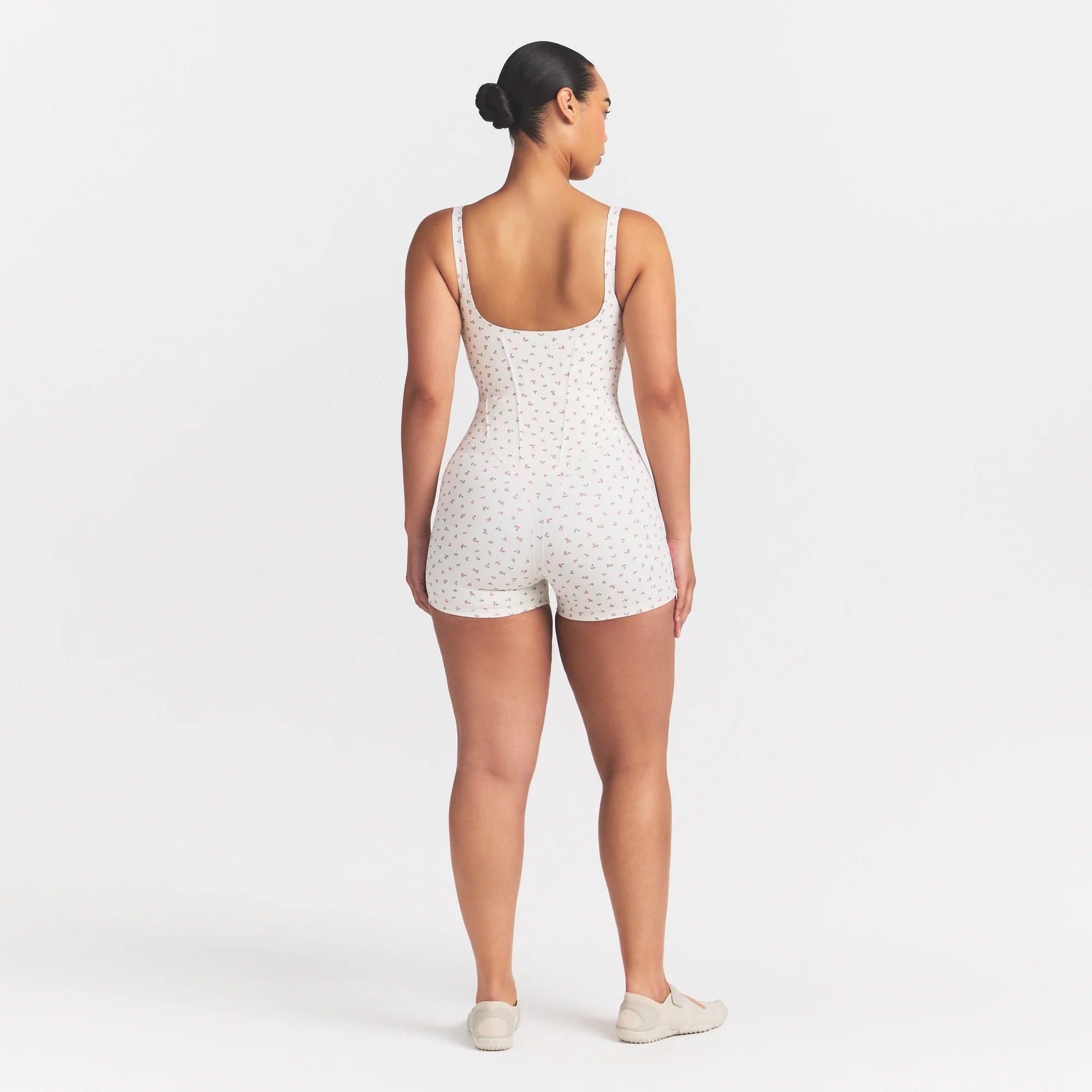 NikeSKIMS MATTE CORSET 2" ONE PIECE | DITSY FLORAL PRINT ON A MODEL @ | FOCUS: 0.0, 1.0, 0.9