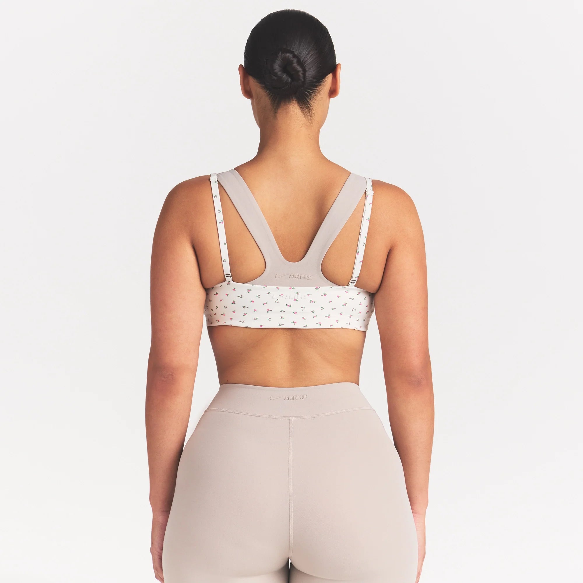 NikeSKIMS MATTE MICRO SCOOP BRA | DITSY FLORAL PRINT ON A MODEL 