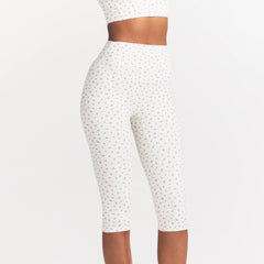 NikeSKIMS MATTE CROP 17" LEGGING | DITSY FLORAL PRINT ON A MODEL 