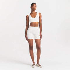 NikeSKIMS MATTE 5" BIKER SHORT | DITSY FLORAL PRINT ON A MODEL 