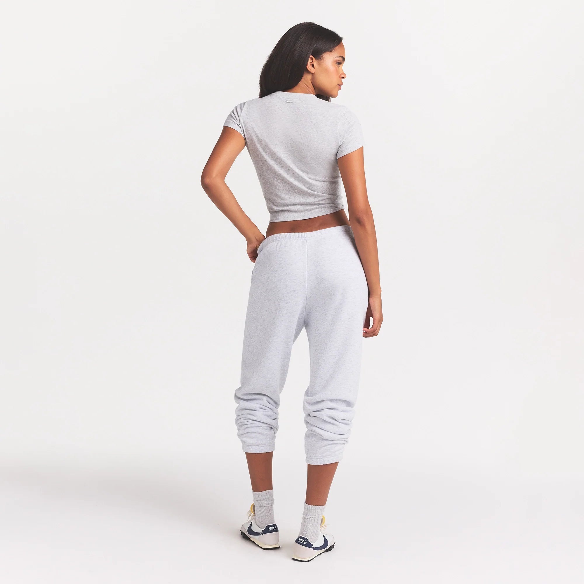 COTTON FLEECE CLASSIC JOGGER | LIGHT HEATHER GREY ON A MODEL BACK VIEW @ | FOCUS: 0.0, 1.0, 0.9