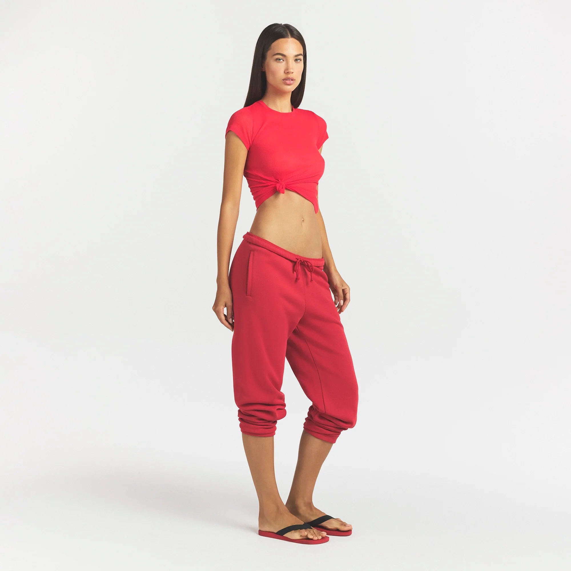 COTTON FLEECE CLASSIC JOGGER | WASHED RED ON A MODEL SIDE VIEW @ | FOCUS: 0.0, 1.0, 0.9
