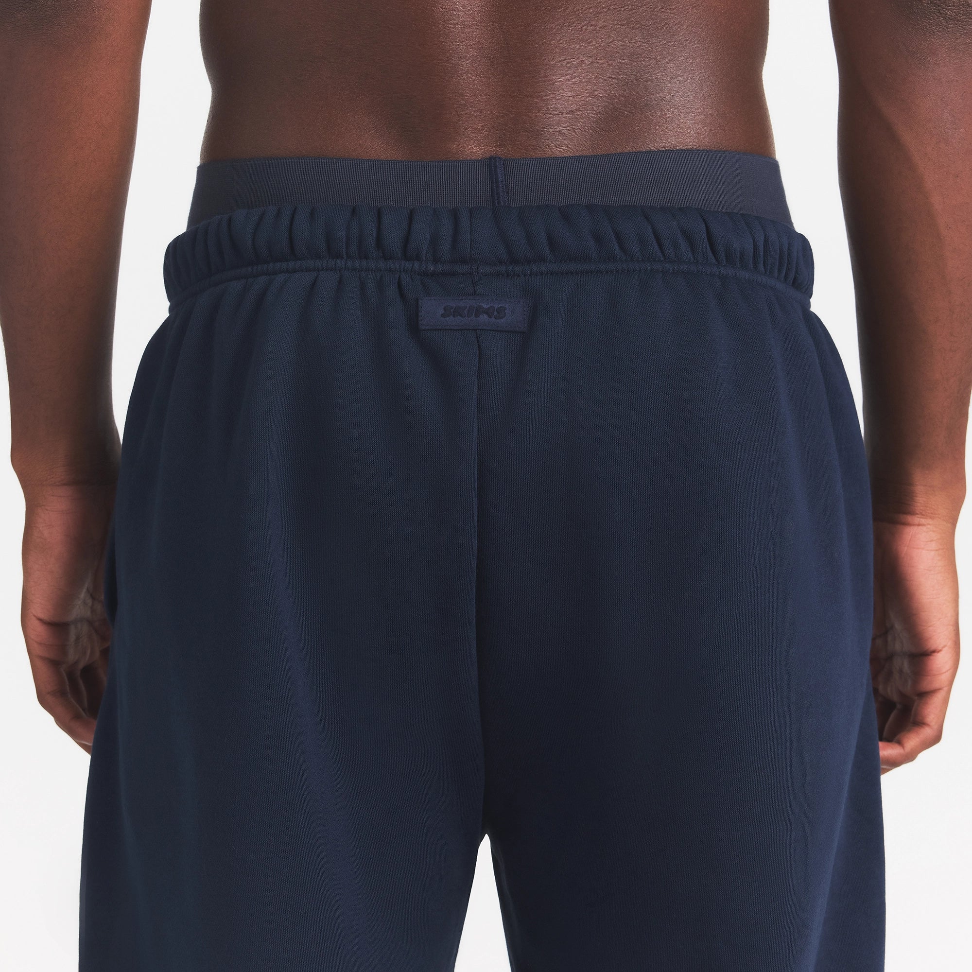 FLEECE LOUNGE MENS RELAXED JOGGER | NAVY ON A MODEL BACK VIEW | FOCUS: 0.0, 1.0, 0.9