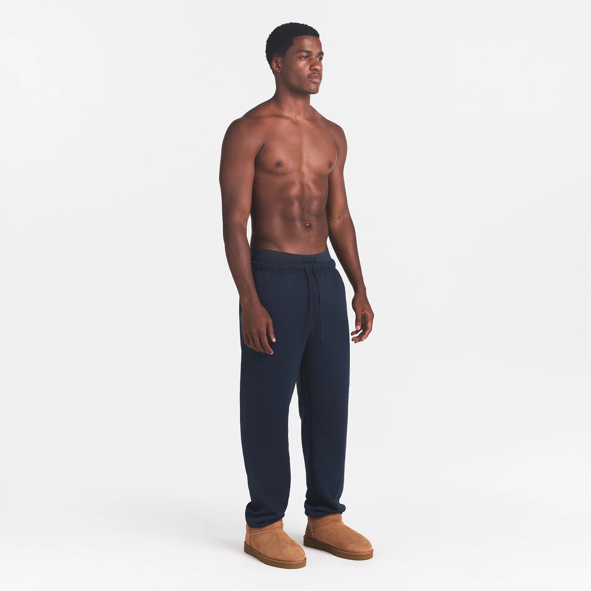 FLEECE LOUNGE MENS RELAXED JOGGER | NAVY ON A MODEL SIDE VIEW | FOCUS: 0.0, 1.0, 0.9