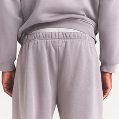 FLEECE LOUNGE MENS RELAXED JOGGER | SHADOW ON A MODEL SIDE VIEW @ | FOCUS: 0.0, 1.0, 0.9