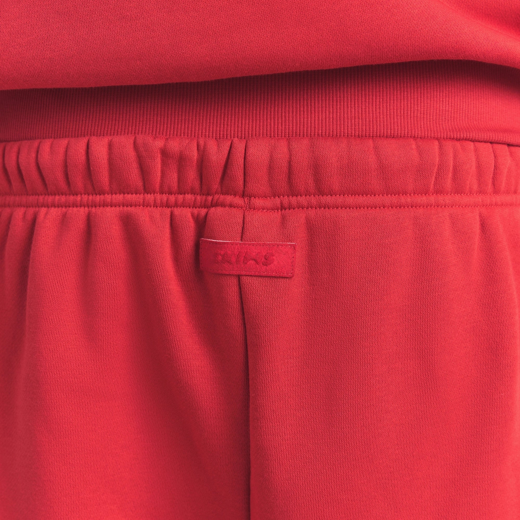 FLEECE LOUNGE MENS CLASSIC STRAIGHT LEG PANT | WASHED RED ON A MODEL SIDE VIEW @ | FOCUS: 0.0, 1.0, 0.9