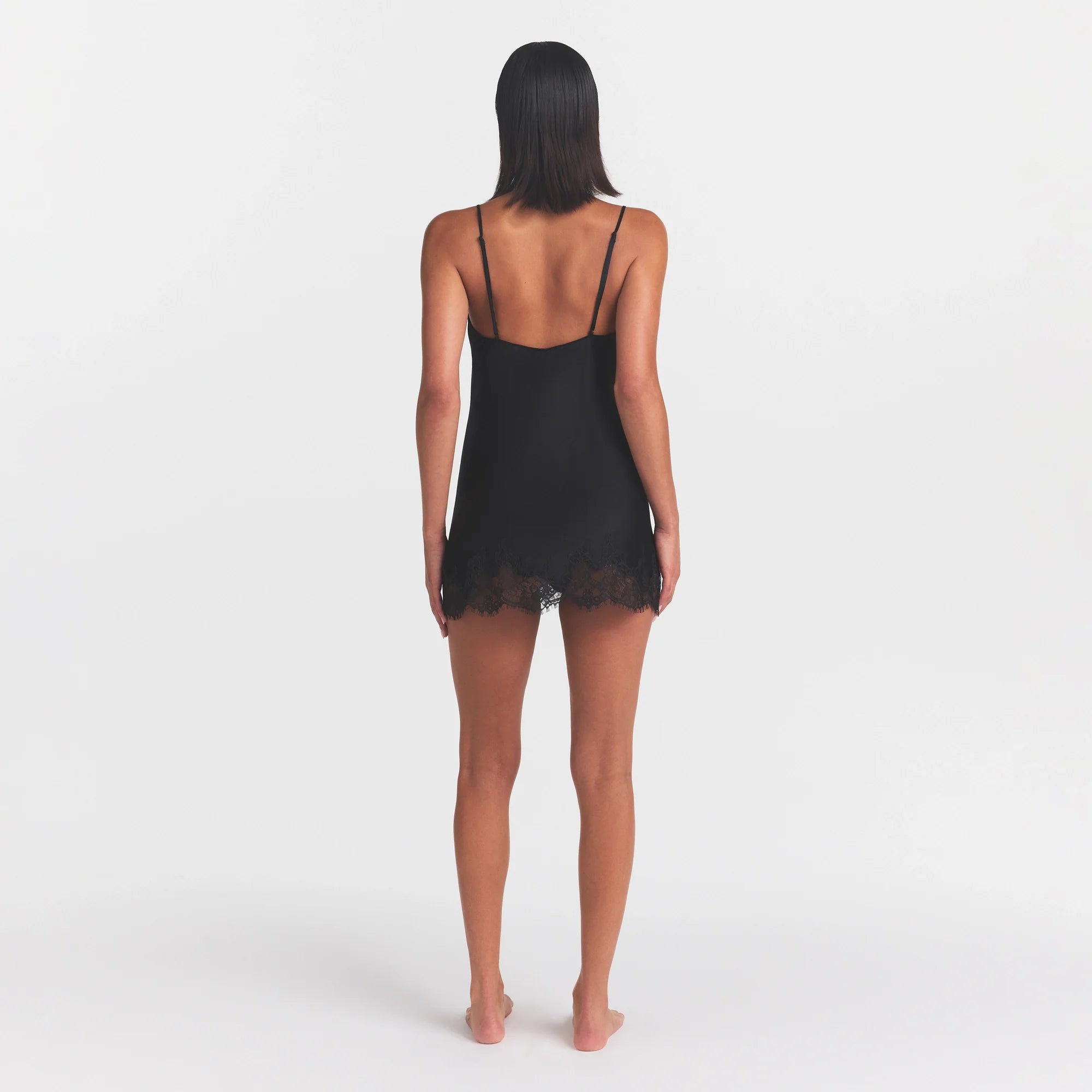 SILK LACE MINI SLIP DRESS | ONYX ON A MODEL FRONT VIEW @ | FOCUS: 0.0, 1.0, 0.9