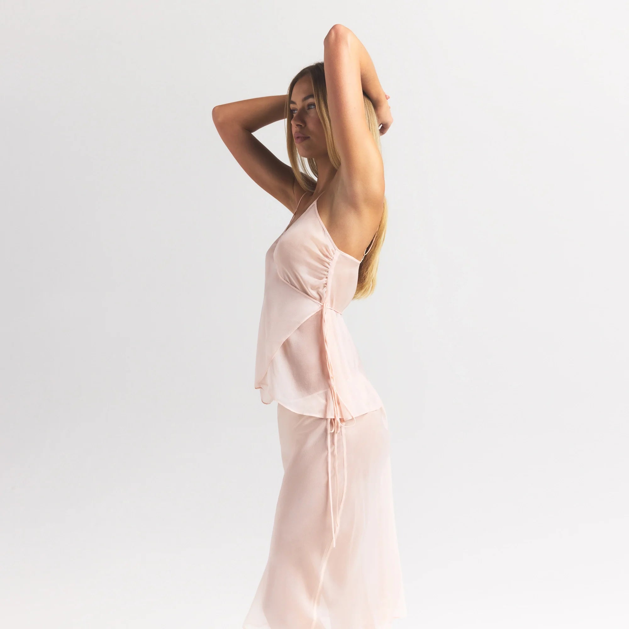 SKIMS ROMANCE WRAP CAMI TOP | PRIMROSE ON A MODEL SIDE VIEW @ | FOCUS: 0.0, 1.0, 0.9