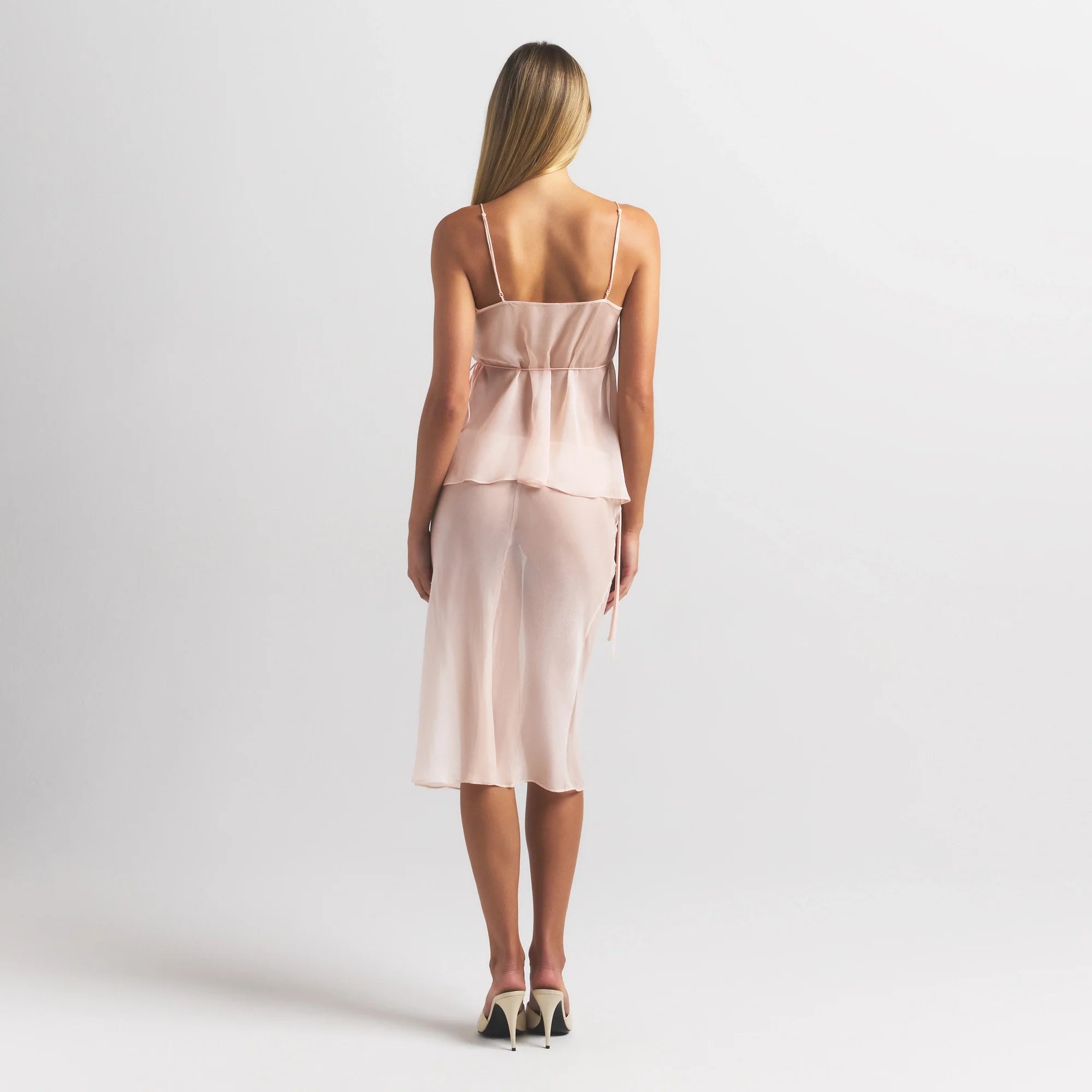 SKIMS ROMANCE WRAP CAMI TOP | PRIMROSE ON A MODEL FRONT VIEW @ | FOCUS: 0.0, 1.0, 0.9