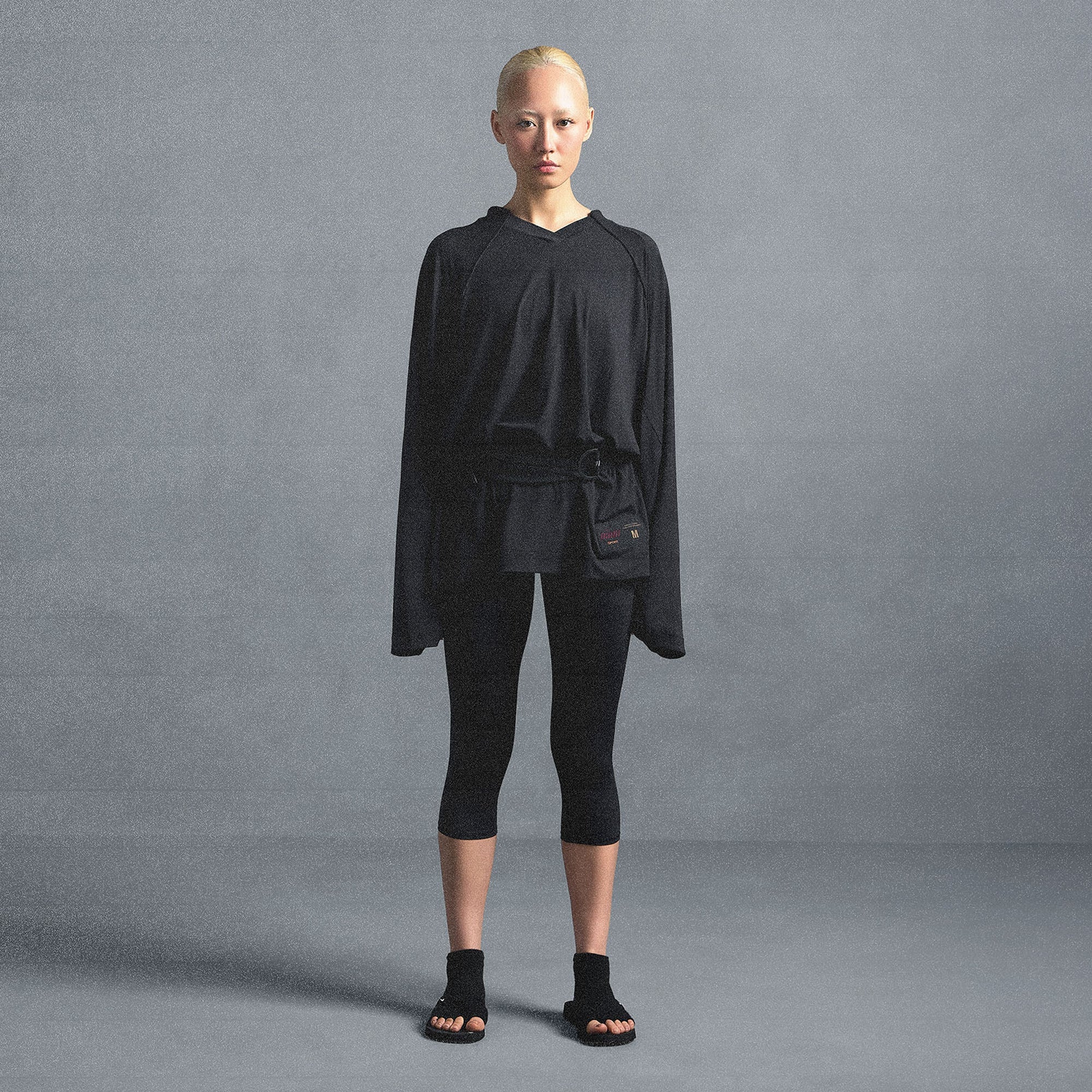 NikeSKIMS AIRY V-NECK OVERSIZED LONG SLEEVE TOP | OBSIDIAN ON A MODEL SIDE VIEW @ | FOCUS: 0.0, 1.0, 0.9