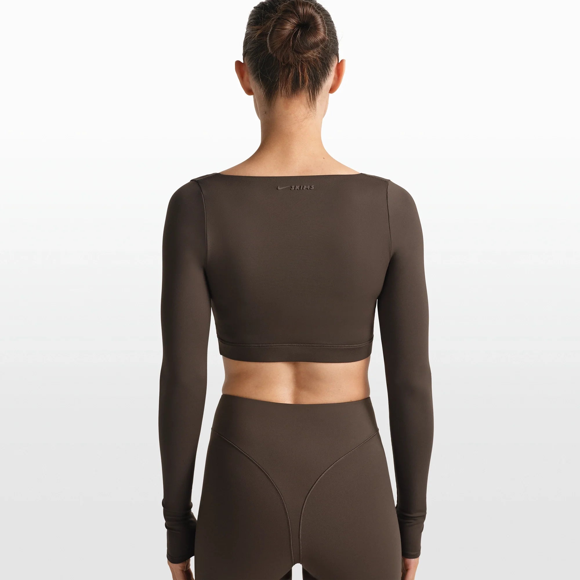 NikeSKIMS MATTE WRAP LONG SLEEVE CROPPED TOP | DARK SEPIA ON A MODEL FRONT VIEW @ | FOCUS: 0.0, 1.0, 0.9