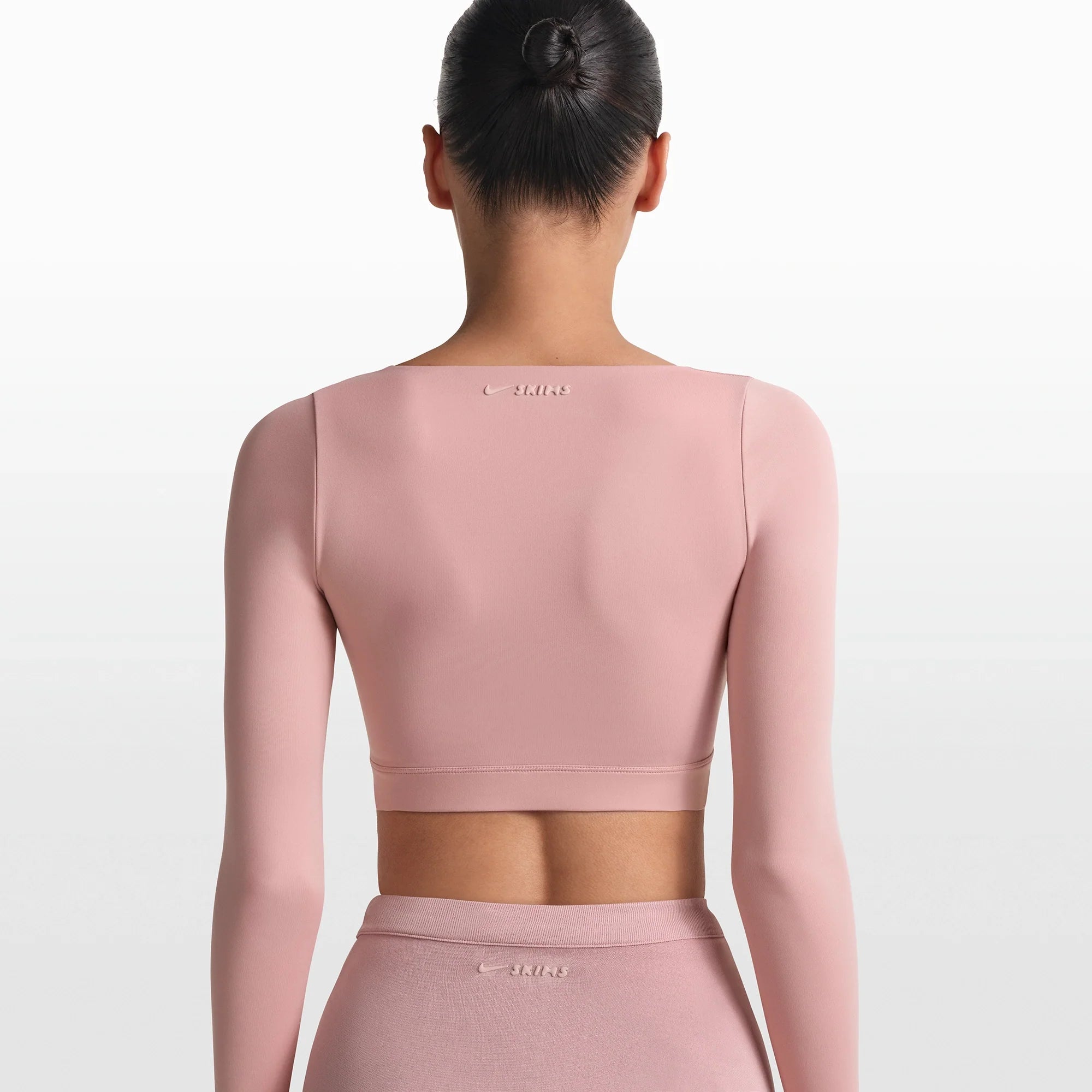 NikeSKIMS MATTE WRAP LONG SLEEVE CROPPED TOP | HIMALAYAN ON A MODEL FRONT VIEW @ | FOCUS: 0.0, 1.0, 0.9