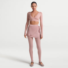 NikeSKIMS MATTE WRAP LONG SLEEVE CROPPED TOP | HIMALAYAN ON A MODEL FRONT VIEW @ | FOCUS: 0.0, 1.0, 0.9