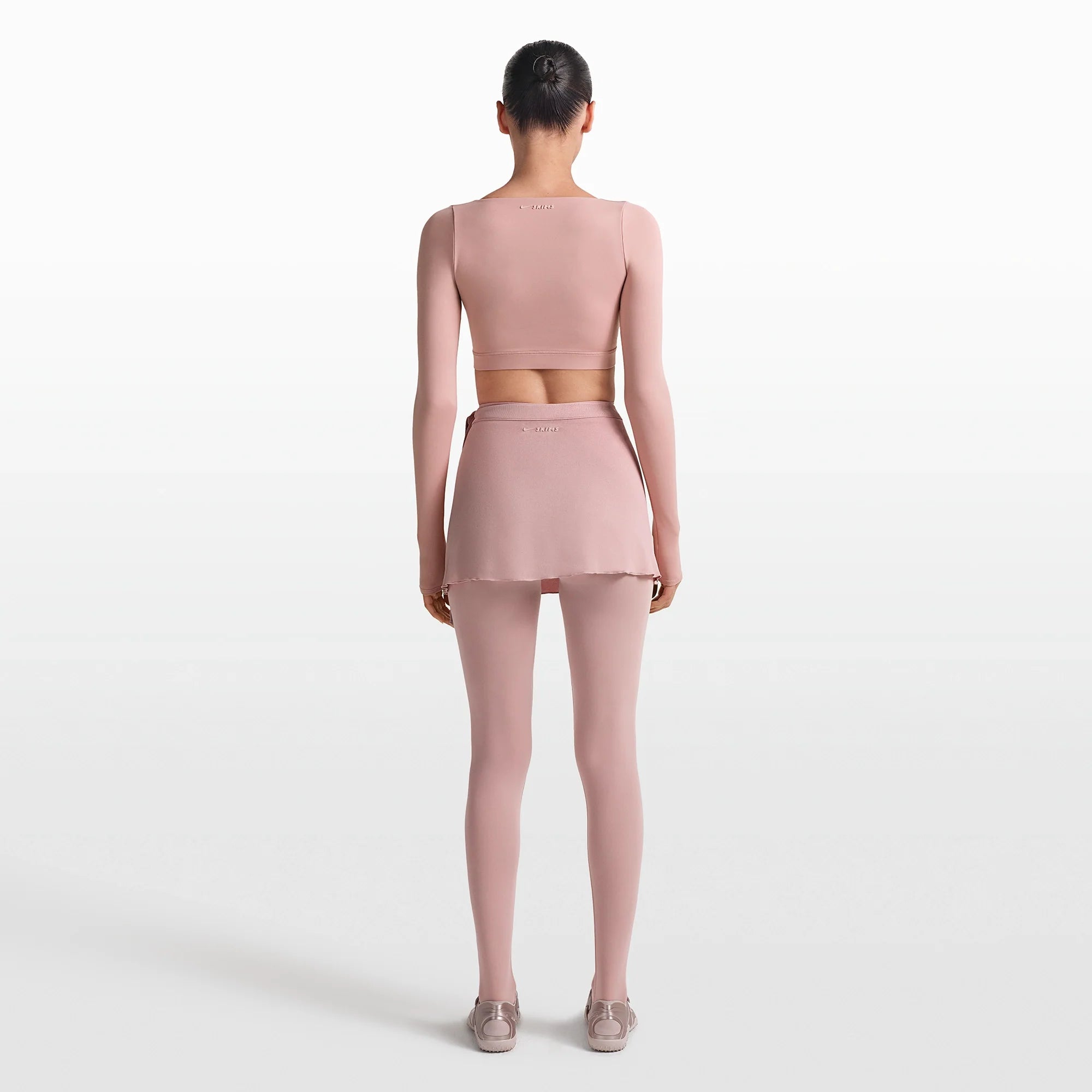 NikeSKIMS MATTE WRAP LONG SLEEVE CROPPED TOP | HIMALAYAN ON A MODEL FRONT VIEW @ | FOCUS: 0.0, 1.0, 0.9