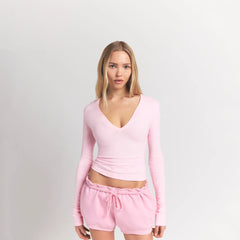 COTTON JERSEY LONG SLEEVE DEEP PLUNGE TOP | CHERRY BLOSSOM ON A MODEL FRONT VIEW S | FOCUS: 0.0, 1.0, 0.9