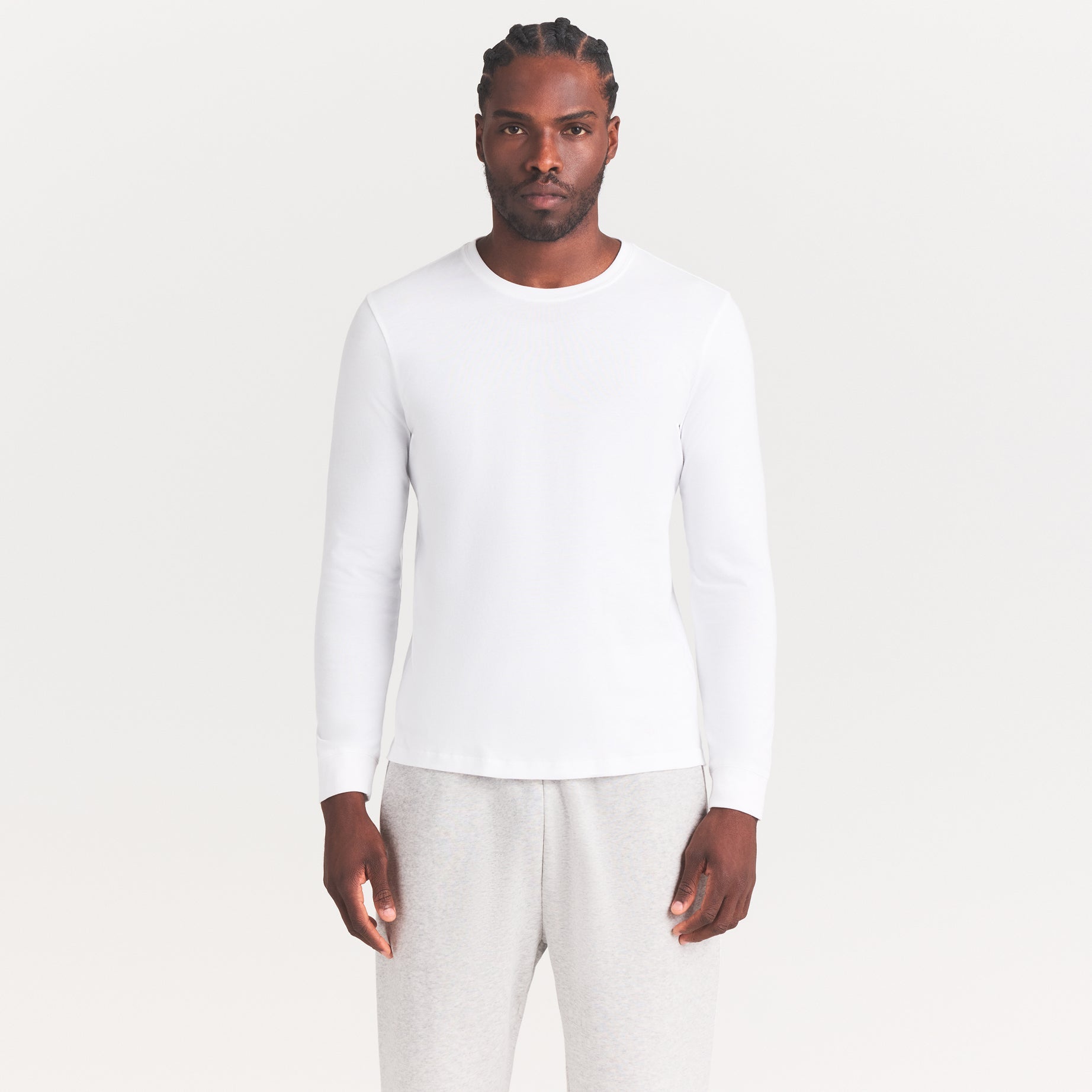 SKIMS COTTON MENS CLASSIC LONG SLEEVE T-SHIRT | CHALK ON A MODEL SIDE VIEW | FOCUS: 0.0, 1.0, 0.9