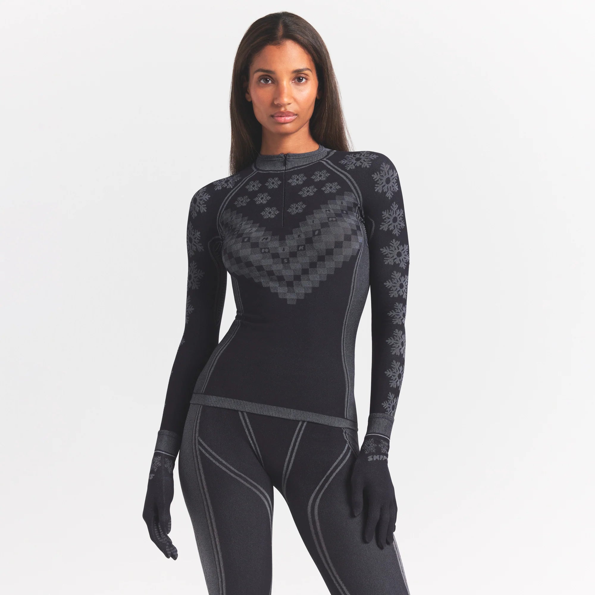 SKIMS FIRST LAYERS HALF ZIP LONG SLEEVE | OBSIDIAN WINTER FAIR ISLE ON A MODEL SIDE VIEW @ | FOCUS: 0.0, 1.0, 0.9